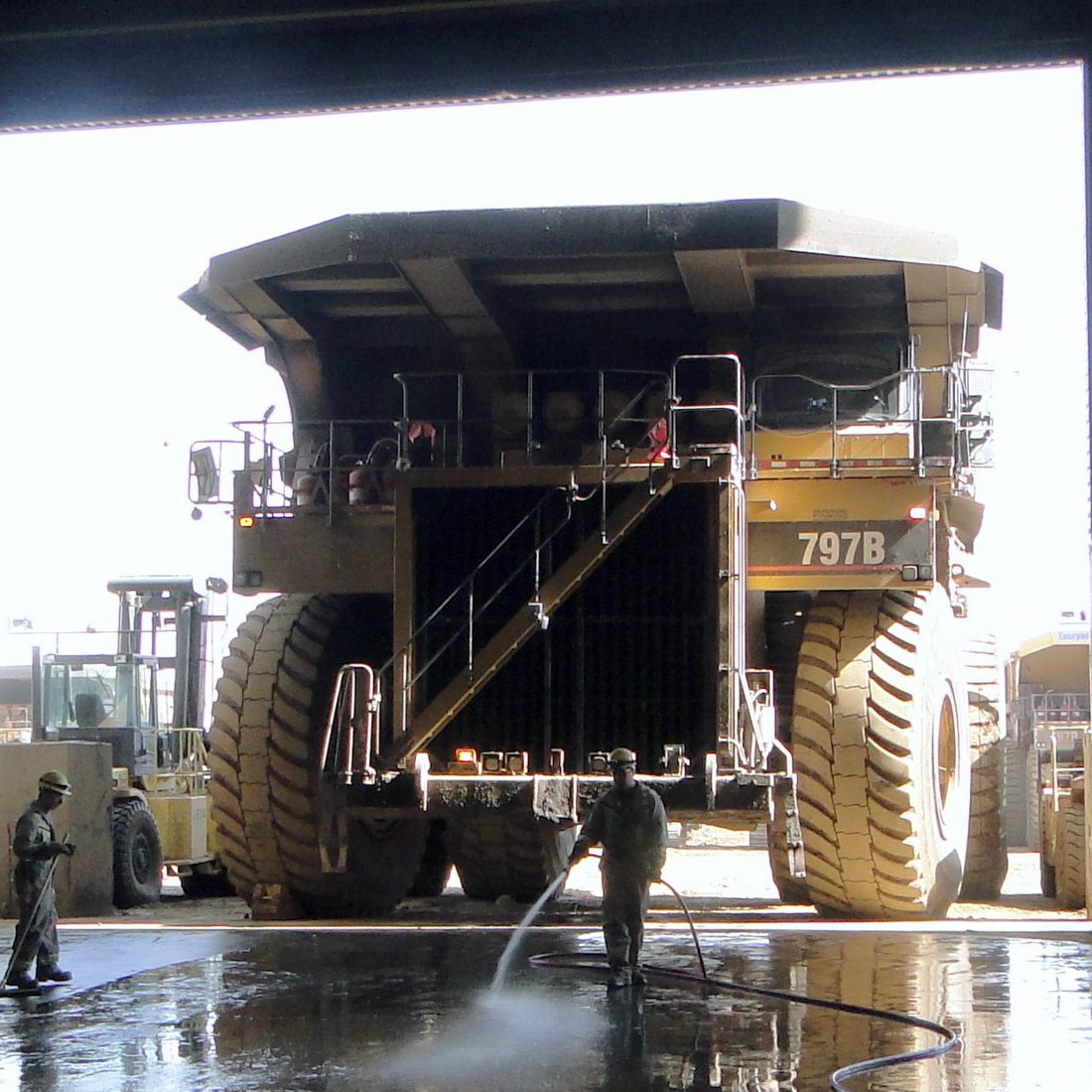 Truck Shop 1x1 large haul truck, men working in truck shop
